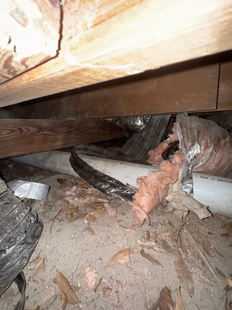 Crawl space inspection showing damaged insulation and ductwork